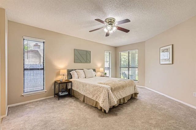 1711 Provident Ln, Round Rock, TX 78664 - bedroom featuring light colored carpet, a textured ceiling, baseboards, and a ceiling fan