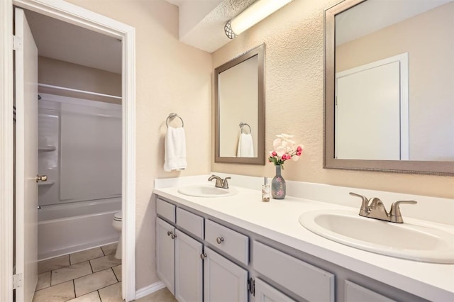 1711 Provident Ln, Round Rock, TX 78664 - bathroom featuring double vanity, toilet, and washtub / shower combination