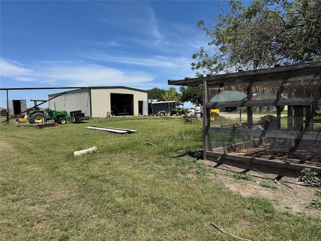 21424 Martin Ln, Pflugerville, TX 78660 - view of grassy yard featuring a detached garage, an outdoor structure, and a pole building