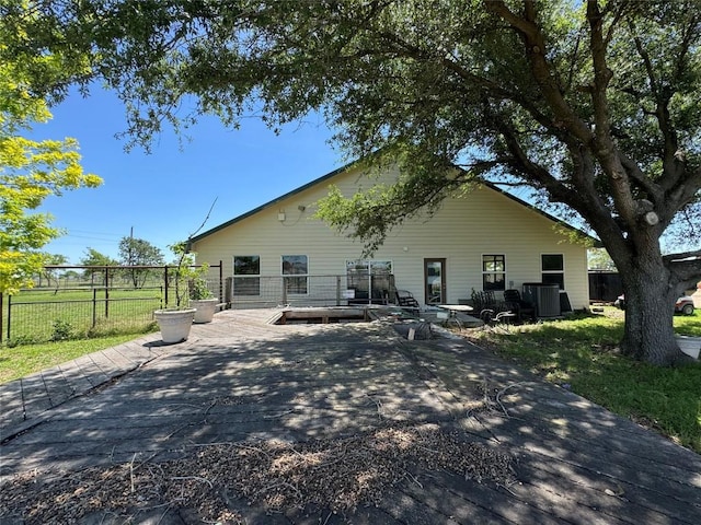 21424 Martin Ln, Pflugerville, TX 78660 - rear view of property with a patio and central AC unit