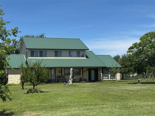 21424 Martin Ln, Pflugerville, TX 78660 - view of front facade featuring a front yard, a porch, and metal roof