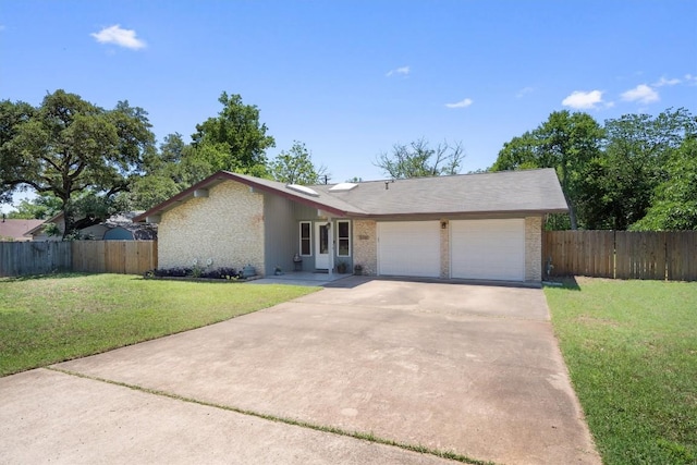 single story home featuring an attached garage and driveway