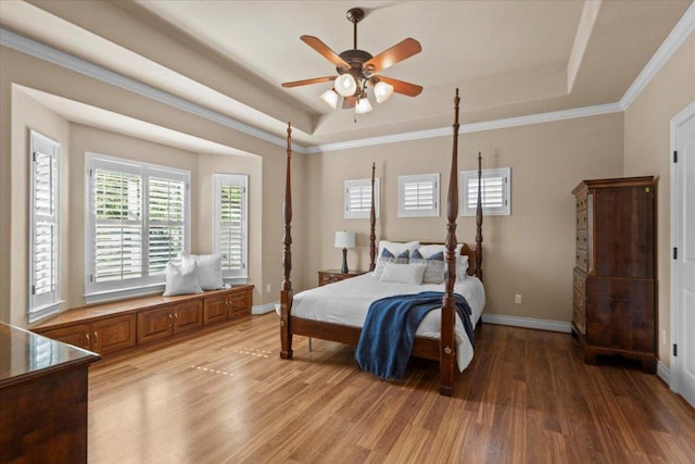 5124 Hidden Springs Trl, Georgetown, TX 78633 - bedroom with a tray ceiling, light wood-style floors, baseboards, crown molding, and ceiling fan