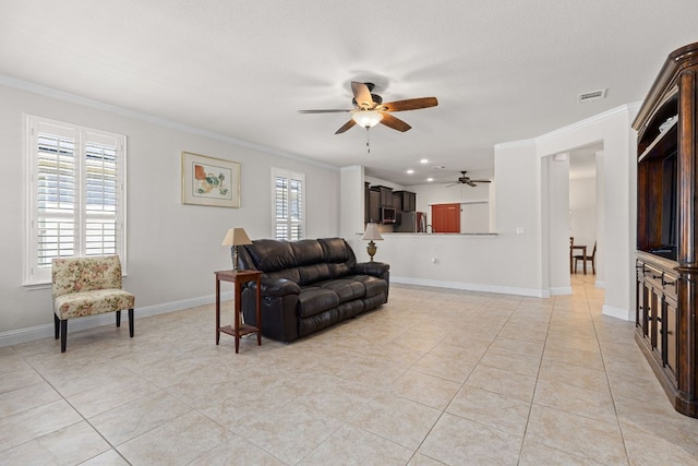 126 Cathedral Mountain Pass, Georgetown, TX 78633 - living area featuring ceiling fan, crown molding, light tile patterned floors, and baseboards