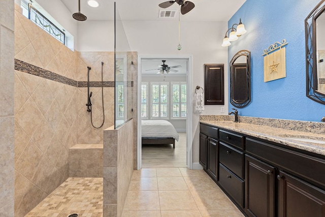 126 Cathedral Mountain Pass, Georgetown, TX 78633 - bathroom featuring a ceiling fan, double vanity, walk in shower, and tile patterned flooring
