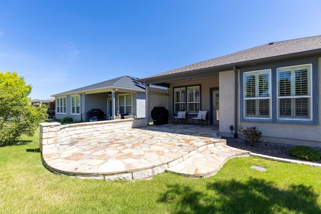 126 Cathedral Mountain Pass, Georgetown, TX 78633 - rear view of property with a patio, stucco siding, and a lawn