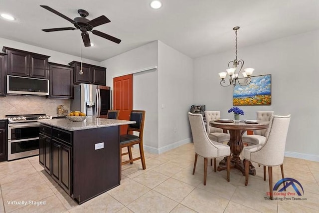 126 Cathedral Mountain Pass, Georgetown, TX 78633 - kitchen featuring stainless steel appliances, recessed lighting, backsplash, a chandelier, and ceiling fan
