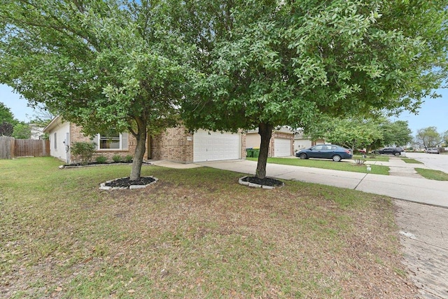 13213 Marie Ln, Manor, TX 78653 - view of property hidden behind natural elements with concrete driveway and brick siding