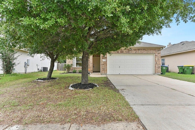 13213 Marie Ln, Manor, TX 78653 - view of property hidden behind natural elements featuring driveway, a garage, brick siding, a front lawn, and central air condition unit