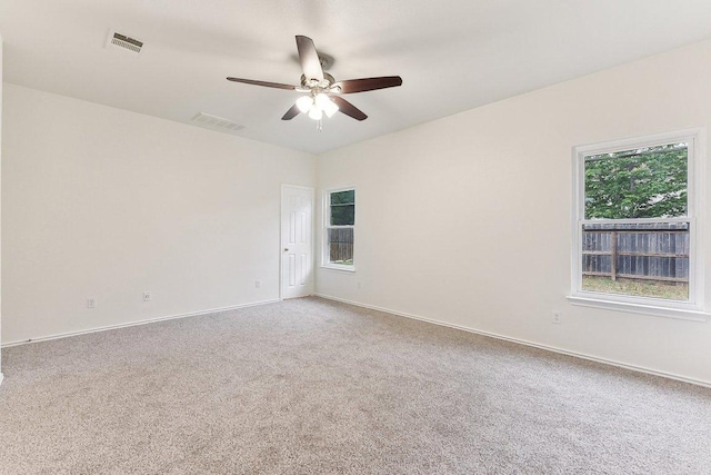13213 Marie Ln, Manor, TX 78653 - unfurnished room featuring light carpet, ceiling fan, and baseboards