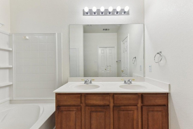 13213 Marie Ln, Manor, TX 78653 - full bath with double vanity and a tub to relax in
