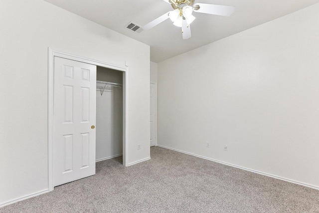 13213 Marie Ln, Manor, TX 78653 - unfurnished bedroom with light colored carpet, a closet, ceiling fan, and baseboards