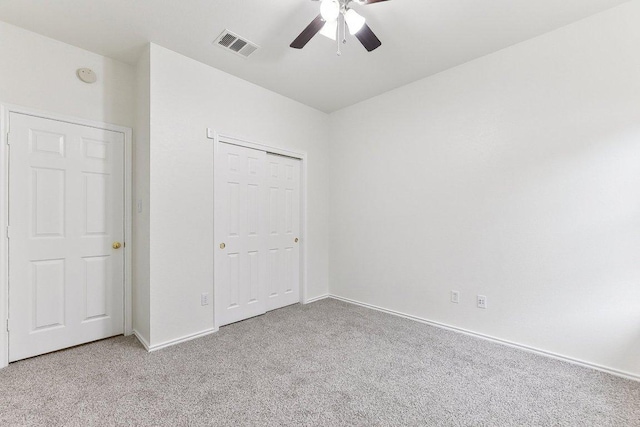 13213 Marie Ln, Manor, TX 78653 - unfurnished bedroom with carpet flooring, baseboards, a closet, and ceiling fan