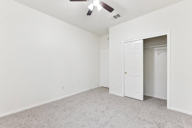 13213 Marie Ln, Manor, TX 78653 - unfurnished bedroom featuring light carpet, baseboards, a ceiling fan, and a closet
