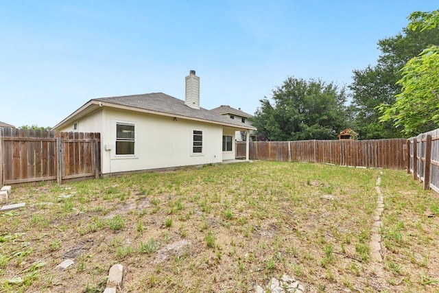 13213 Marie Ln, Manor, TX 78653 - back of house with a chimney