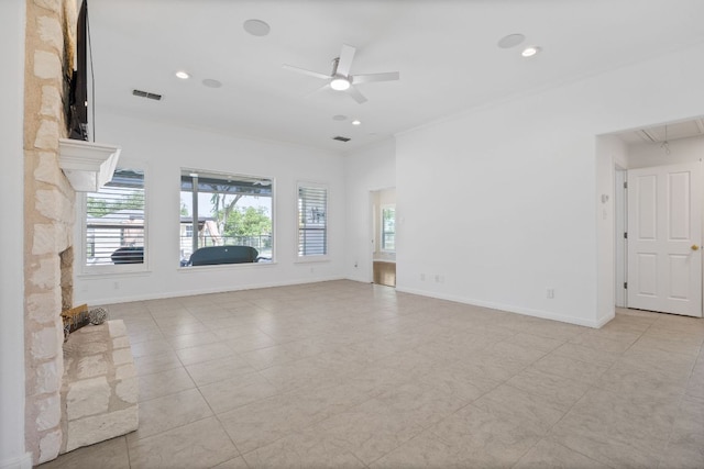 tiled spare room with healthy amount of natural light, ceiling fan, baseboards, recessed lighting, and crown molding