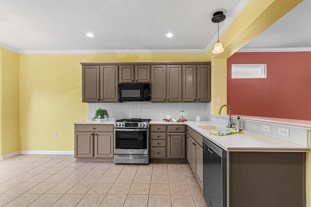 409 Rio Grande Loop, Georgetown, TX 78633 - kitchen featuring appliances with stainless steel finishes, a sink, crown molding, backsplash, and light countertops
