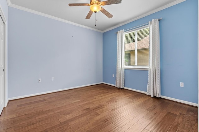 409 Rio Grande Loop, Georgetown, TX 78633 - empty room featuring crown molding, wood finished floors, a ceiling fan, and baseboards