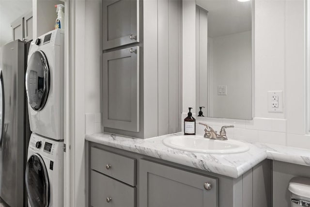 1610 Tejas Trl, Blanco, TX 78606 - bathroom with estacked washer and dryer and vanity