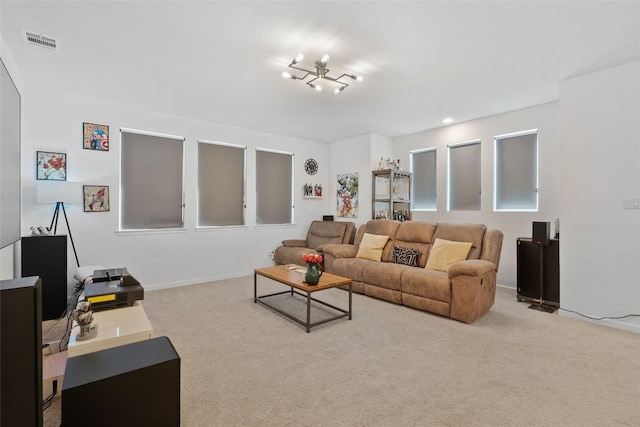 carpeted living area featuring baseboards and recessed lighting