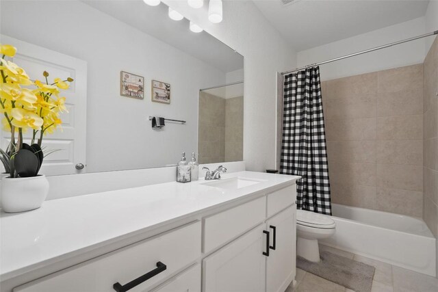 full bathroom with toilet, tile patterned flooring, vanity, and shower / bath combination with curtain
