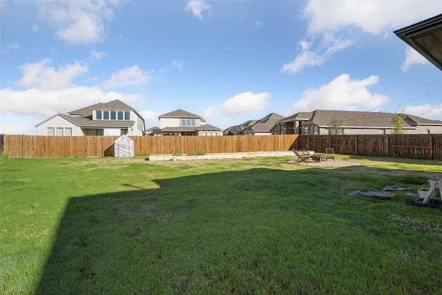 view of yard with an outdoor fire pit