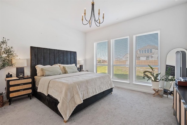 208 Dycus Bnd, Liberty Hill, TX 78642 - bedroom featuring carpet flooring and a chandelier