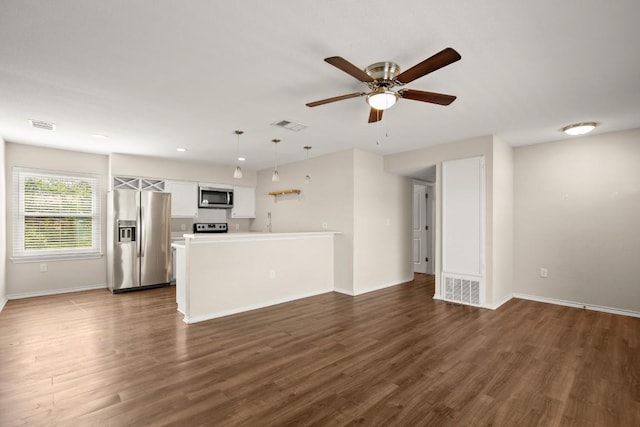 4603 Englewood Dr, Austin, TX 78745 - unfurnished living room with dark wood-type flooring and ceiling fan