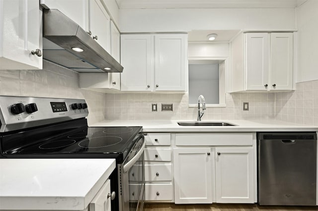 2122 Hancock Dr Unit 103, Austin, TX 78756 - kitchen with appliances with stainless steel finishes, under cabinet range hood, a sink, white cabinetry, and light countertops