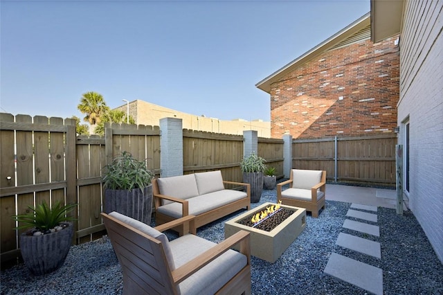 2122 Hancock Dr Unit 103, Austin, TX 78756 - view of patio / terrace featuring an outdoor living space with a fire pit and a fenced backyard