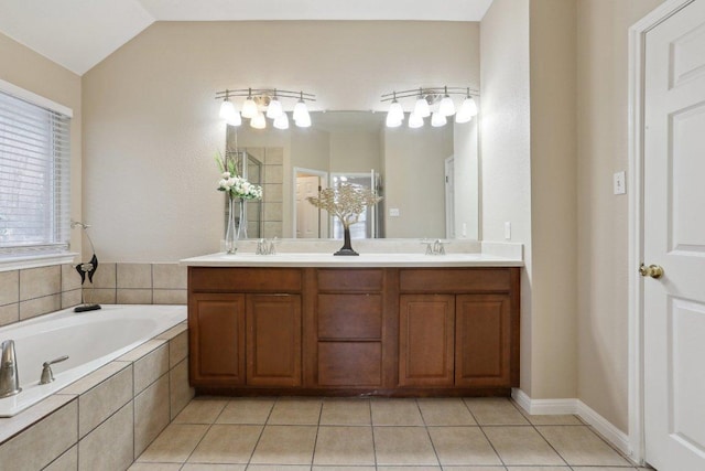 8400 Fern Bluff Ave, Round Rock, TX 78681 - full bath featuring double vanity, a garden tub, tile patterned floors, and lofted ceiling