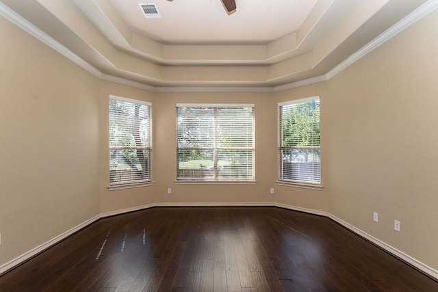 unfurnished room with hardwood / wood-style floors, a ceiling fan, and baseboards
