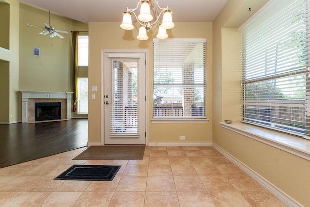 604 Riley Trl, Cedar Park, TX 78613 - entryway featuring a chandelier, plenty of natural light, light tile patterned flooring, and a ceiling fan