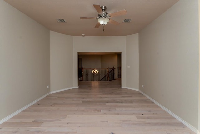 604 Riley Trl, Cedar Park, TX 78613 - spare room featuring a ceiling fan, wood finished floors, baseboards, and a chandelier