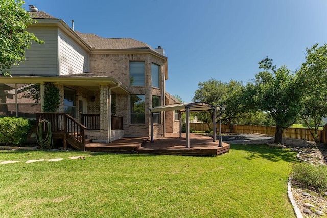 view of yard with a pergola and a wooden deck