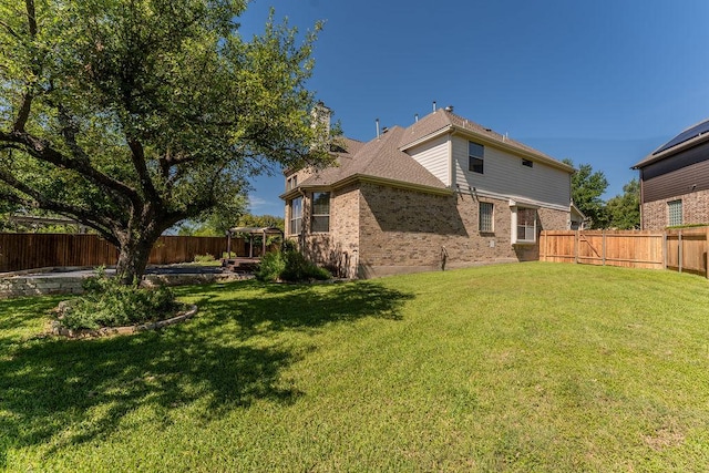 back of property featuring brick siding