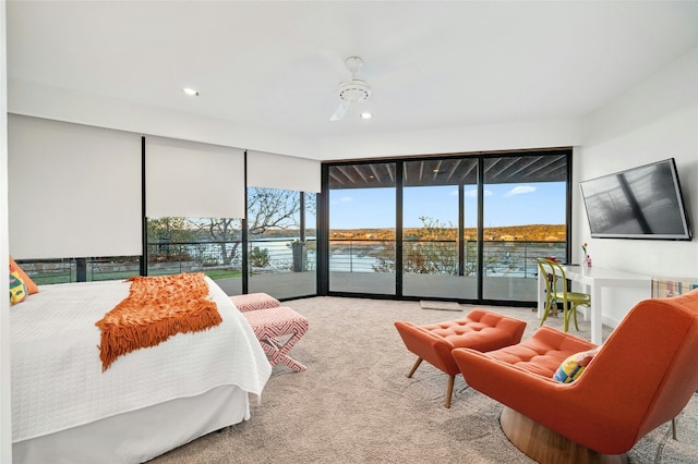 carpeted bedroom featuring access to outside, multiple windows, and recessed lighting