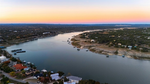 aerial view of property's location featuring a nearby body of water