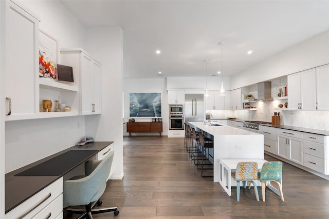 2500 Cedarview Dr, Austin, TX 78704 - kitchen featuring built in appliances, open shelves, a breakfast bar, dark wood-style floors, and white cabinetry