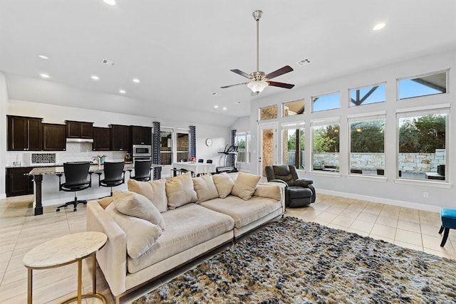 107 Orange Mimosa Ln, Leander, TX 78641 - living area with light tile patterned floors, recessed lighting, ceiling fan, lofted ceiling, and baseboards