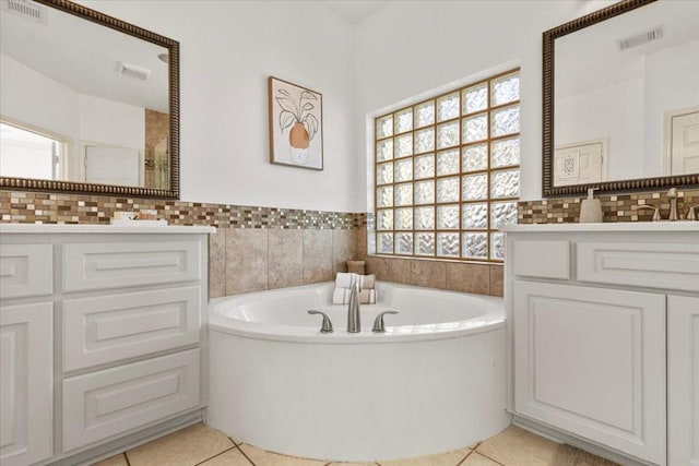 3313 Oxsheer Dr, Austin, TX 78732 - bathroom with tile patterned flooring, plenty of natural light, a bath, vanity, and tile walls