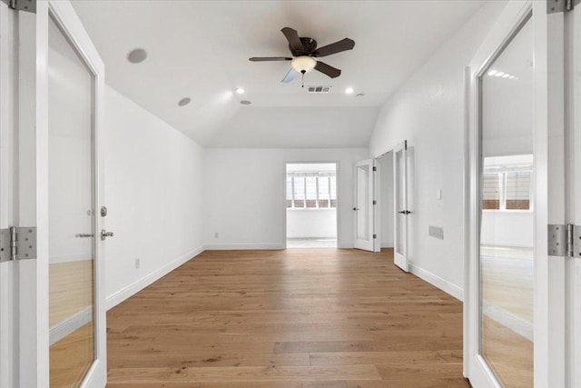 3313 Oxsheer Dr, Austin, TX 78732 - empty room featuring light wood-style floors, a ceiling fan, lofted ceiling, baseboards, and recessed lighting