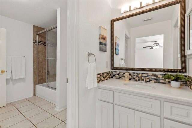 3313 Oxsheer Dr, Austin, TX 78732 - full bathroom with tile patterned flooring, vanity, combined bath / shower with glass door, and decorative backsplash