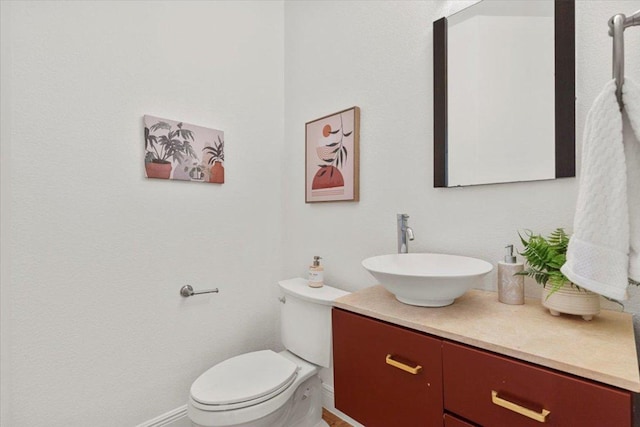 3313 Oxsheer Dr, Austin, TX 78732 - half bathroom with vanity, toilet, and baseboards