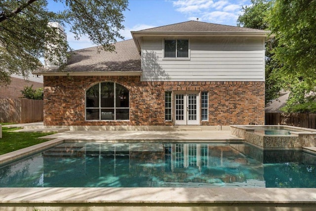 3313 Oxsheer Dr, Austin, TX 78732 - back of property featuring french doors, a fenced backyard, a patio, and brick siding