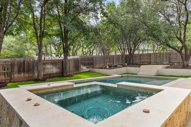 3313 Oxsheer Dr, Austin, TX 78732 - view of swimming pool with a fenced backyard and a pool with connected hot tub