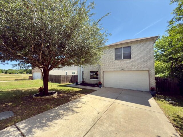 7817 Marble Ridge Dr, Austin, TX 78747 - view of front of property featuring an attached garage, brick siding, and driveway