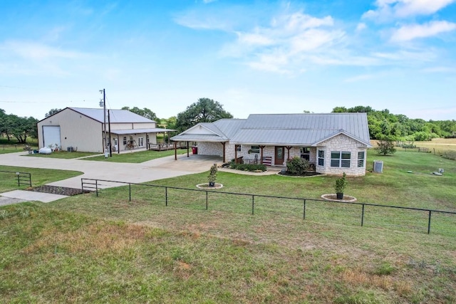 603 Watterson Rd Unit B, Bastrop, TX 78602 - ranch-style house featuring concrete driveway, stone siding, a porch, an attached carport, and metal roof
