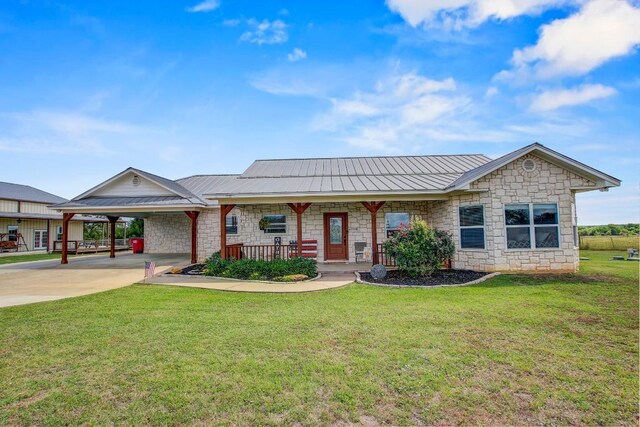 603 Watterson Rd Unit B, Bastrop, TX 78602 - single story home featuring stone siding, concrete driveway, a porch, and a front yard