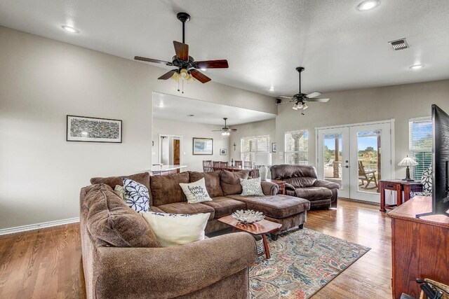 603 Watterson Rd Unit B, Bastrop, TX 78602 - living room featuring ceiling fan, french doors, wood finished floors, recessed lighting, and baseboards
